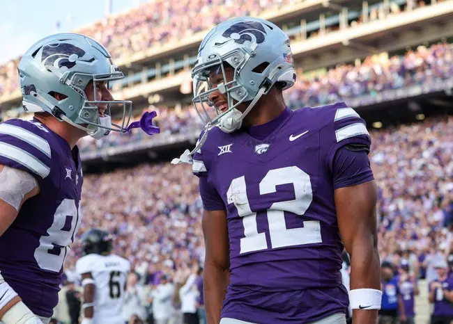 Sep 6, 2025; Manhattan, Kansas, USA; Kansas State Wildcats wide receiver Jaron Tibbs (12) and tight end Garrett Oakley (86) celebrate a touchdown catch by Tibbs during the second quarter against the Army Black Knights at Bill Snyder Family Football Stadium. Mandatory Credit: Scott Sewell-Imagn Images