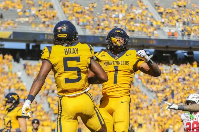 Aug 30, 2025; Morgantown, West Virginia, USA; West Virginia Mountaineers running back Jahiem White (1) scores a touchdown and celebrates with West Virginia Mountaineers wide receiver Jaden Bray (5) during the third quarter at Milan Puskar Stadium. Mandatory Credit: Ben Queen-Imagn Images