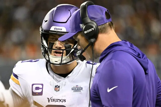 Sep 8, 2025; Chicago, Illinois, USA; Minnesota Vikings head coach Kevin O'Connell talks with quarterback J.J. McCarthy (9) during the first half at Soldier Field. Mandatory Credit: Matt Marton-Imagn Images
