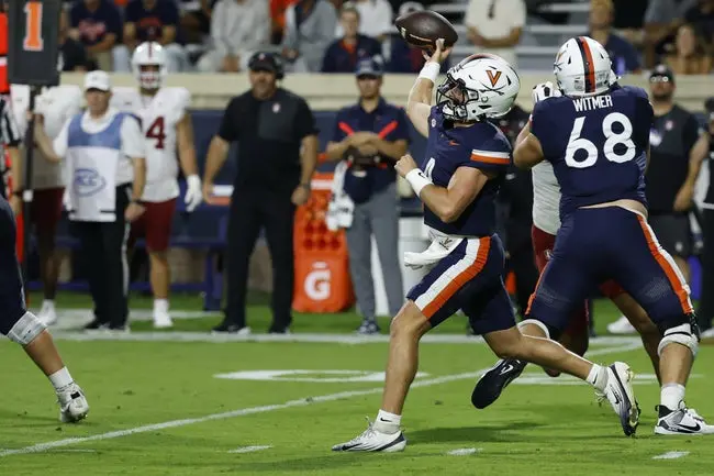 featured-image-1758743603427 Sep 20, 2025; Charlottesville, Virginia, USA; Virginia Cavaliers quarterback Chandler Morris (4) throws a touchdown pass to Cavaliers wide receiver Trell Harris (not pictured) against the Stanford Cardinal during the first quarter at Scott Stadium. Mandatory Credit: Geoff Burke-Imagn Images