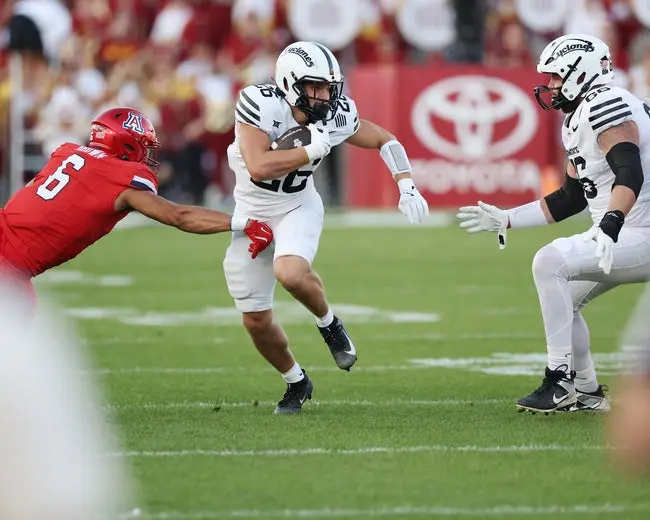 Sep 27, 2025; Ames, Iowa, USA; Iowa State Cyclones running back Carson Hansen (26) runs the football against the Arizona Wildcats during the first half at Jack Trice Stadium. Mandatory Credit: Reese Strickland-Imagn Images