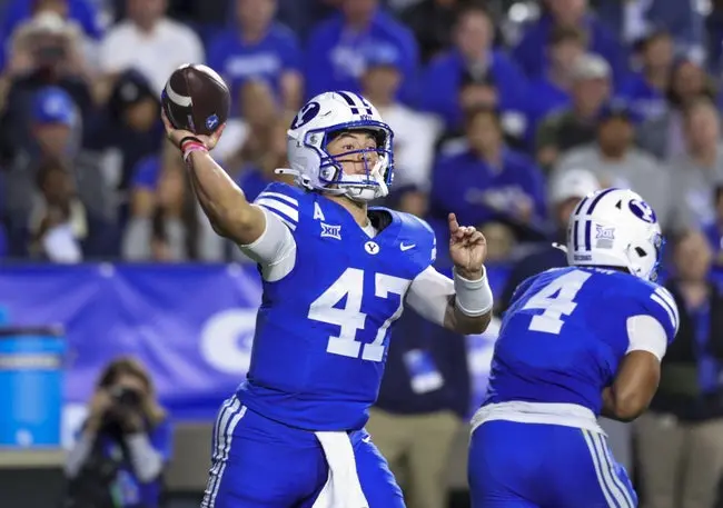 Oct 3, 2025; Provo, Utah, USA; Brigham Young Cougars quarterback Bear Bachmeier (47) throws the ball against the West Virginia Mountaineers during the second quarter at LaVell Edwards Stadium. Mandatory Credit: Rob Gray-Imagn Images