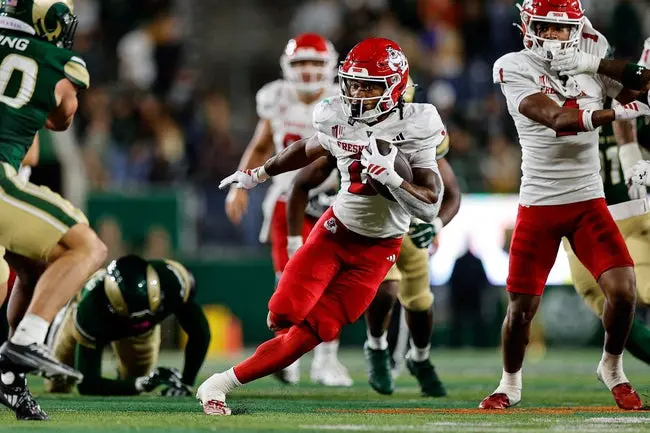 Oct 10, 2025; Fort Collins, Colorado, USA; Fresno State Bulldogs running back Rayshon Luke (2) runs the ball in the third quarter against the Colorado State Rams at Sonny Lubick Field at Canvas Stadium. Mandatory Credit: Isaiah J. Downing-Imagn Images