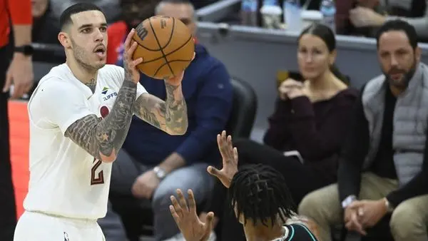 Dec 3, 2025; Cleveland, Ohio, USA; Cleveland Cavaliers guard Lonzo Ball (2) shoots a three-point basket in the fourth quarter against the Portland Trail Blazers at Rocket Arena. Mandatory Credit: David Richard-Imagn Images