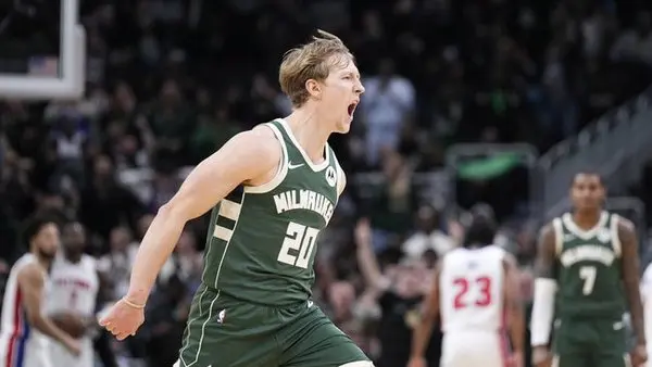 Dec 3, 2025; Milwaukee, Wisconsin, USA; Milwaukee Bucks guard AJ Green (20) yells out during a time out after a made three point shot against the Detroit Pistons at Fiserv Forum. Mandatory Credit: Michael McLoone-Imagn Images