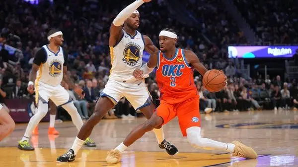 Dec 2, 2025; San Francisco, California, USA; Oklahoma City Thunder guard Shai Gilgeous-Alexander (2) dribbles the ball next to Golden State Warriors guard Buddy Hield (7) in the fourth quarter at the Chase Center. Mandatory Credit: Cary Edmondson-Imagn Images