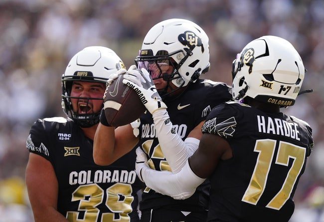 Sep 6, 2025; Boulder, Colorado, USA; Colorado Buffaloes wide receiver Kaleb Mathis (13) and wide receiver Isaiah Hardge (17) celebrate a special teams play in the second half against the Delaware Fightin Blue Hens at Folsom Field. Mandatory Credit: Ron Chenoy-Imagn Images