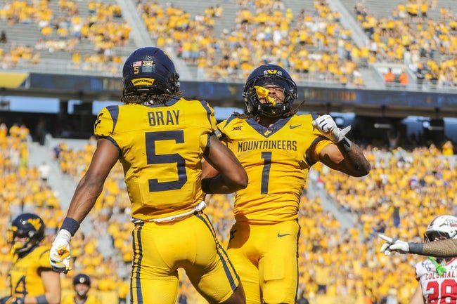 Aug 30, 2025; Morgantown, West Virginia, USA; West Virginia Mountaineers running back Jahiem White (1) scores a touchdown and celebrates with West Virginia Mountaineers wide receiver Jaden Bray (5) during the third quarter at Milan Puskar Stadium. Mandatory Credit: Ben Queen-Imagn Images