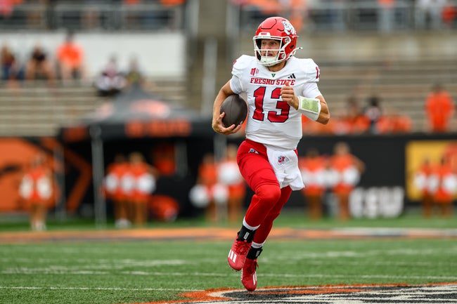 Sep 6, 2025; Corvallis, Oregon, USA; Fresno State Bulldogs quarterback E.J. Warner (13) runs the ball for a touchdown during the first quarter against the Oregon State Beavers at Reser Stadium. Mandatory Credit: Craig Strobeck-Imagn Images