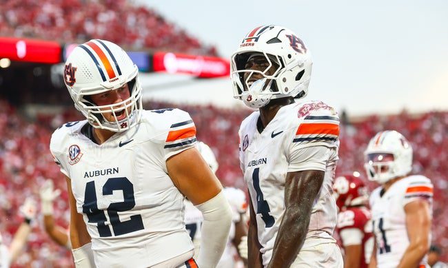 Sep 20, 2025; Norman, Oklahoma, USA; Auburn Tigers wide receiver Malcolm Simmons (4) celebrates with Auburn Tigers tight end Tate Johnson (42) after scoring a touchdown during the second half against the Oklahoma Sooners at Gaylord Family-Oklahoma Memorial Stadium. Mandatory Credit: Kevin Jairaj-Imagn Images