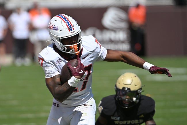 Sep 20, 2025; Blacksburg, Virginia, USA; Virginia Tech Hokies running back Marcellous Hawkins (27) runs the ball during the second quarter against the Wofford Terriers at Lane Stadium. Mandatory Credit: Brian Bishop-Imagn Images