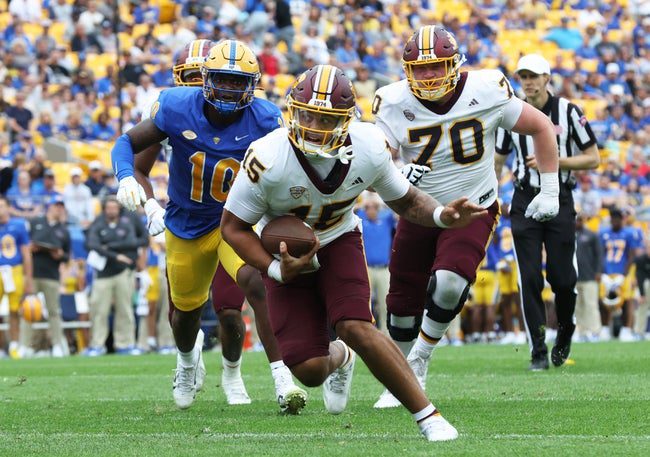 Sep 6, 2025; Pittsburgh, Pennsylvania, USA; Central Michigan Chippewas quarterback Jadyn Glasser (15) scores a touchdown against the Pittsburgh Panthers during the second quarter at Acrisure Stadium. Mandatory Credit: Charles LeClaire-Imagn Images