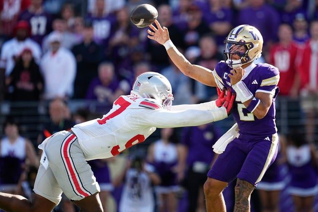 Ohio State Buckeyes defensive end Kenyatta Jackson Jr. (97) pressures Washington Huskies quarterback Demond Williams Jr. (2) during the second half of the NCAA football game at Husky Stadium in Seattle on Sept. 27, 2025. Ohio State won 24-6.