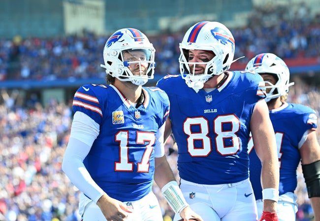 Sep 28, 2025; Orchard Park, New York, USA; Buffalo Bills quarterback Josh Allen (17) and tight end Dawson Knox (88) react after diving for a touchdown past New Orleans Saints cornerback Alontae Taylor (1) during the third quarter at Highmark Stadium. Mandatory Credit: Mark Konezny-Imagn Images