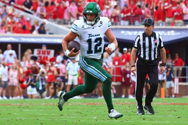 Sep 20, 2025; Oxford, Mississippi, USA; Tulane Green Wave quarterback Jake Retzlaff (12) runs the ball during the second quarter against the Mississippi Rebels at Vaught-Hemingway Stadium. Mandatory Credit: Petre Thomas-Imagn Images
