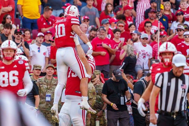 Sep 20, 2025; Lincoln, Nebraska, USA; Nebraska Cornhuskers tight end Heinrich Haarberg (10) and Nebraska Cornhuskers offensive lineman Shawn Hammerbeck (79) celebrate after a touchdown against the Michigan Wolverines during the fourth quarter at Memorial Stadium. Mandatory Credit: Dylan Widger-Imagn Images