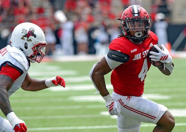 Jacksonville StateÕs Cam Cook scores a touchdown as LibertyÕs Deuce Spurlock defends during college school football action at AmFirst Stadium in Jacksonville, Alabama September 6, 2025. (Dave Hyatt / Hyatt Media LLC)