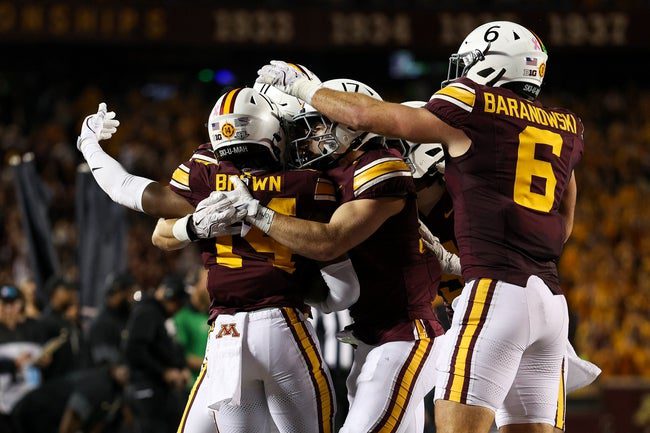 Oct 11, 2025; Minneapolis, Minnesota, USA; Minnesota Golden Gophers defensive back Kerry Brown (14) celebrates his interception against the Purdue Boilermakers during the first half at Huntington Bank Stadium. Mandatory Credit: Matt Krohn-Imagn Images
