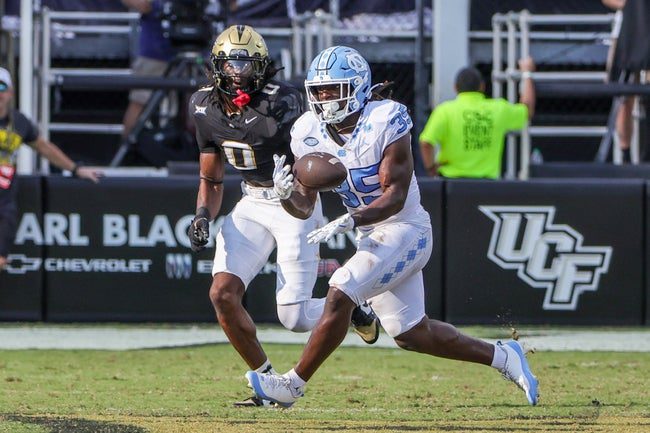Sep 20, 2025; Orlando, Florida, USA; Carolina Tar Heels running back Demon June (35) catches a pass during the second quarter against the UCF Knights at the Bounce House Stadium. Mandatory Credit: Mike Watters-Imagn Images
