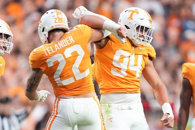 Tennessee linebacker Jeremiah Telander (22) and Tennessee defensive lineman Nathan Robinson (94) celebrate on the field during a college football game between Tennessee and Arkansas at Neyland Stadium in Knoxville, Tennessee on Oct. 11, 2025.