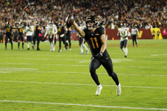 Oct 13, 2025; Landover, Maryland, USA; Washington Commanders wide receiver Luke McCaffrey (11) scores a touchdown against the Chicago Bears during the third quarter at Northwest Stadium. Mandatory Credit: Geoff Burke-Imagn Images