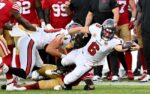 Oct 12, 2025; Tampa, Florida, USA; Tampa Bay Buccaneers quarterback Baker Mayfield (6) dives for a first down during the third quarter against the San Francisco 49ers at Raymond James Stadium. Mandatory Credit: Jonathan Dyer-Imagn Images