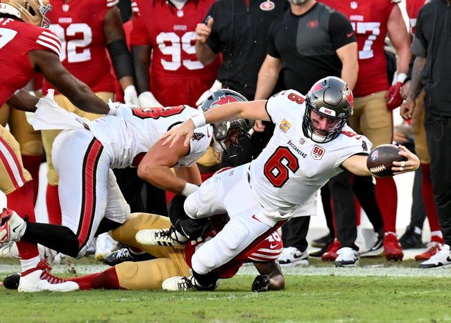 Oct 12, 2025; Tampa, Florida, USA; Tampa Bay Buccaneers quarterback Baker Mayfield (6) dives for a first down during the third quarter against the San Francisco 49ers at Raymond James Stadium. Mandatory Credit: Jonathan Dyer-Imagn Images