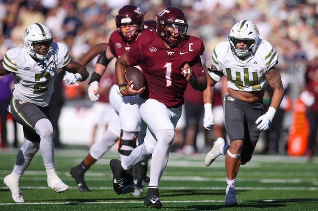 Oct 11, 2025; Atlanta, Georgia, USA; Virginia Tech Hokies quarterback Kyron Drones (1) runs the ball for a touchdown against the Georgia Tech Yellow Jackets in the second quarter at Bobby Dodd Stadium at Hyundai Field. Mandatory Credit: Brett Davis-Imagn Images