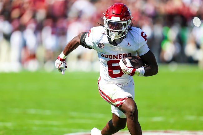 Oct 18, 2025; Columbia, South Carolina, USA; Oklahoma Sooners running back Tory Blaylock (6) rushes against the South Carolina Gamecocks in the first quarter at Williams-Brice Stadium. Mandatory Credit: Jeff Blake-Imagn Images