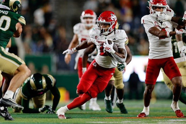 Oct 10, 2025; Fort Collins, Colorado, USA; Fresno State Bulldogs running back Rayshon Luke (2) runs the ball in the third quarter against the Colorado State Rams at Sonny Lubick Field at Canvas Stadium. Mandatory Credit: Isaiah J. Downing-Imagn Images