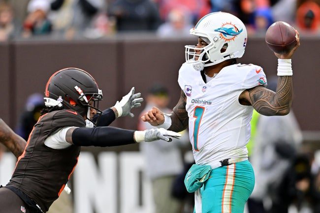 Oct 19, 2025; Cleveland, Ohio, USA; Cleveland Browns safety Grant Delpit (9) rushes Miami Dolphins quarterback Tua Tagovailoa (1) during the second half at Huntington Bank Field. Mandatory Credit: Ken Blaze-Imagn Images