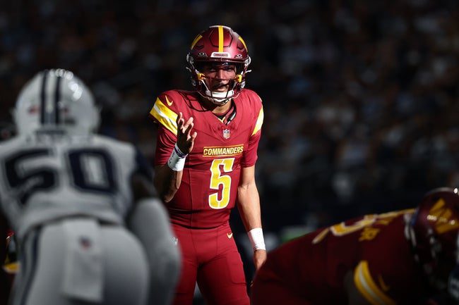 Oct 19, 2025; Arlington, Texas, USA; Washington Commanders quarterback Jayden Daniels (5) calls a play at the line of scrimmage against the Dallas Cowboys =d2q of the game at AT&T Stadium. Mandatory Credit: Kevin Jairaj-Imagn Images