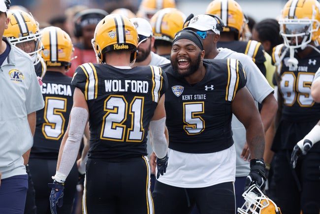 Kent State defensive lineman Thomas Aden (5) celebrates as running back Cade Wolford (21) comes to the bench after scoring a touchdown against Buffalo on Sept. 13, 2025, in Kent.