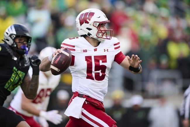 Oct 25, 2025; Eugene, Oregon, USA; Wisconsin Badgers quarterback Hunter Simmons (15) throws a pass during the first half against the Oregon Ducks at Autzen Stadium. Mandatory Credit: Troy Wayrynen-Imagn Images