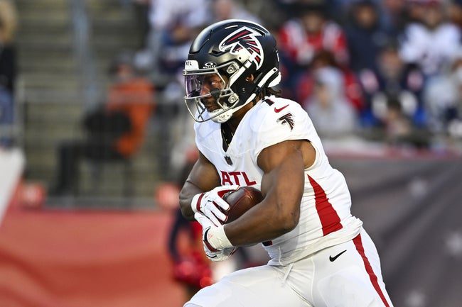 Nov 2, 2025; Foxborough, Massachusetts, USA; Atlanta Falcons running back Bijan Robinson (7) runs the ball against the New England Patriots during the third quarter at Gillette Stadium. Mandatory Credit: Eric Canha-Imagn Images