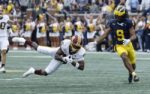 Sep 13, 2025; Ann Arbor, Michigan, USA; Central Michigan Chippewas defensive back Caleb Spann (15) tries to make an interception of a pass attended for Michigan Wolverines wide receiver Channing Goodwin (9) in the first half at Michigan Stadium. Mandatory Credit: Rick Osentoski-Imagn Images