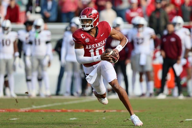 Nov 1, 2025; Fayetteville, Arkansas, USA; Arkansas Razorbacks quarterback Taylen Green (10) rushes during the first quarter against the Mississippi State Bulldogs at Donald W. Reynolds Razorback Stadium. Mandatory Credit: Nelson Chenault-Imagn Images