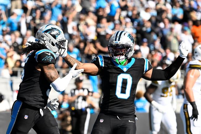 Nov 9, 2025; Charlotte, North Carolina, USA; Carolina Panthers running back Rico Dowdle (5) celebrates with tight end Ja'Tavion Sanders (0) after scoring a touchdown in the first quarter at Bank of America Stadium. Mandatory Credit: Bob Donnan-Imagn Images