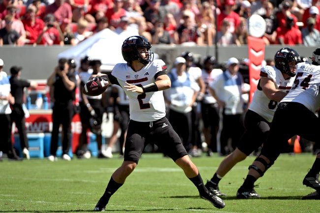 Sep 28, 2024; Raleigh, North Carolina, USA; Northern Illinois Huskies quarterback Ethan Hampton (2) throws a pass against the North Carolina State Wolfpack in the first quarter at Carter-Finley Stadium. Mandatory Credit: Zachary Taft-Imagn Images