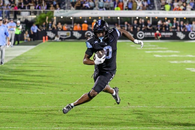 Nov 7, 2025; Orlando, Florida, USA; UCF Knights tight end Dylan Wade (0) runs the ball during the second quarter against the Houston Cougars at Acrisure Bounce House. Mandatory Credit: Mike Watters-Imagn Images