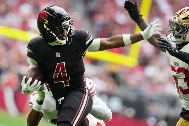 Arizona Cardinals receiver Greg Dortch (4) tries to stiff arm San Francisco 49ers linebacker Dee Winters (53) at State Farm Stadium in Glendale on Nov. 16, 2025.