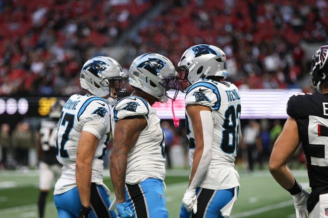 Nov 16, 2025; Atlanta, Georgia, USA; Carolina Panthers tight end Tommy Tremble (82) celebrates a play with quarterback Bryce Young (9) in overtime against the Atlanta Falcons at Mercedes-Benz Stadium. Mandatory Credit: Dale Zanine-Imagn Images