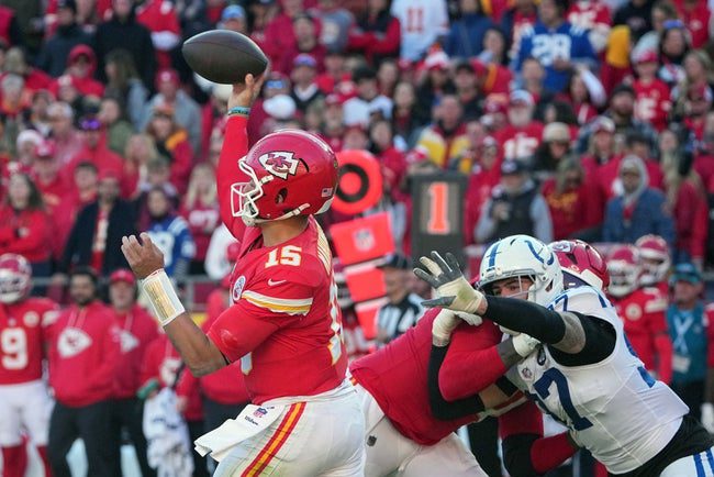 Nov 23, 2025; Kansas City, Missouri, USA; Kansas City Chiefs quarterback Patrick Mahomes (15) throws a pass against Indianapolis Colts defensive end Laiatu Latu (97) in the second half at GEHA Field at Arrowhead Stadium. Mandatory Credit: Denny Medley-Imagn Images