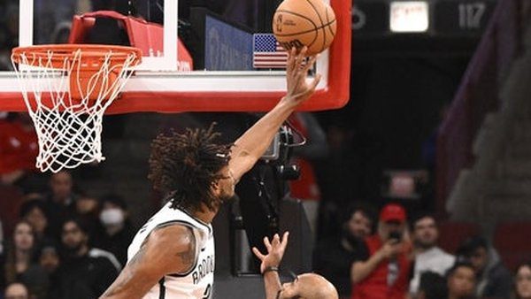 Dec 3, 2025; Chicago, Illinois, USA; Brooklyn Nets center Nic Claxton (33) blocks a shot by Chicago Bulls guard Jevon Carter (5) during the second half at the United Center. Mandatory Credit: Matt Marton-Imagn Images