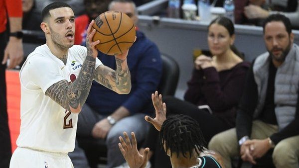 Dec 3, 2025; Cleveland, Ohio, USA; Cleveland Cavaliers guard Lonzo Ball (2) shoots a three-point basket in the fourth quarter against the Portland Trail Blazers at Rocket Arena. Mandatory Credit: David Richard-Imagn Images
