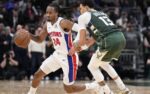 Dec 3, 2025; Milwaukee, Wisconsin, USA; Detroit Pistons guard Daniss Jenkins (24) brings the ball up the court against Milwaukee Bucks guard Ryan Rollins (13) in the second half at Fiserv Forum. Mandatory Credit: Michael McLoone-Imagn Images