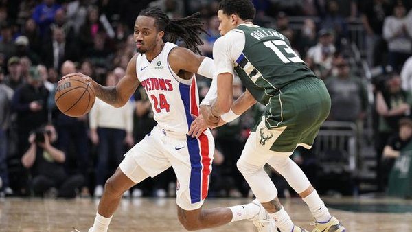 Dec 3, 2025; Milwaukee, Wisconsin, USA; Detroit Pistons guard Daniss Jenkins (24) brings the ball up the court against Milwaukee Bucks guard Ryan Rollins (13) in the second half at Fiserv Forum. Mandatory Credit: Michael McLoone-Imagn Images