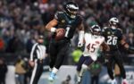 Nov 28, 2025; Philadelphia, Pennsylvania, USA; Philadelphia Eagles quarterback Jalen Hurts (1) scrambles with the ball against the Chicago Bears during the third quarter of the game at Lincoln Financial Field. Mandatory Credit: Bill Streicher-Imagn Images