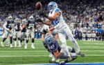 Detroit Lions safety Brian Branch (32) tries to intercept a pass intended for Dallas Cowboys tight end Jake Ferguson (87) during the second half at Ford Field in Detroit on Thursday, Dec. 4, 2025.