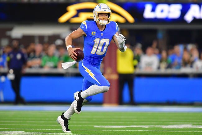 Dec 8, 2025; Inglewood, California, USA; Los Angeles Chargers quarterback Justin Herbert (10) runs against the Philadelphia Eagles in the second half at SoFi Stadium. Mandatory Credit: Gary A. Vasquez-Imagn Images